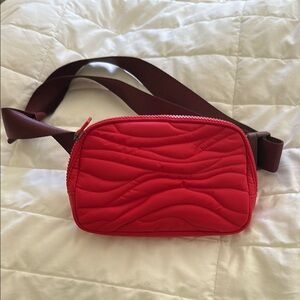 Lululemon
Red Quilted Crossbody Bag with Brown Strap